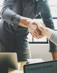 Close-up of a handshake symbolizing partnership and collaboration